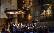 Een optreden van het Nederlands Kamerkoor in de Nieuwe Kerk van Den Haag. beeld Berbera van den Hoek
