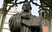 Standbeeld van Maarten Luther in Wittenberg. beeld RD, Henk Visscher
