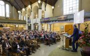 Congres over 50 jaar Open Brief in de Nieuwe Kerk in Kampen. Rechts prof. dr. G. Harinck. beeld RD, Anton Dommerholt