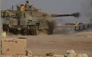 Een Turkse tank in gevecht in het noorden van Syrië. beeld AFP, Nazeer al-Khatib