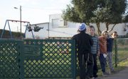 Kinderen in de Joodse buitenpost Amona, op de Westelijke Jordaanoever. Het Israëlische Hooggerechtshof heeft bepaald dat de nederzetting op 25 december ontruimd moet zijn. Dat is elf jaar nadat een lagere rechtbank de buitenpost al als onrechtmatig bestem