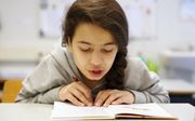 „De bewering dat dyslecten te weinig oefenen, klopt niet. Kinderen met dyslexie lezen over het algemeen de blaren op hun tong.” beeld ANP