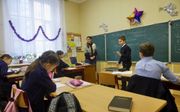 Leerlingen op de christelijke basisschool Izmajil, in het zuiden van Oekraïne. „Op deze school is het onderwijs op christelijke principes gebaseerd. Zo wil ik later ook leven”, zegt de 10-jarige leerling Petro Bukata. beeld Jaco Klamer