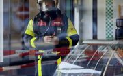 De brandweer in actie bij een geval van koolmonoxidevergiftiging in Den Haag. beeld ANP, Evert-Jan Daniels