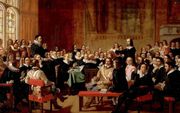 „De Westminster Confessie stelt dat God Zich vrijwillig naar de mens neerboog.” Schilderij: The Westminster Assembly (John Rogers Herbert, circa 1844). beeld Wikimedia