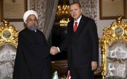 De Iraanse president Rohani (l) en zijn Turkse ambtgenoot Erdogan namen het voortouw bij het protest tegen de verklaring van Trump over de status van Jeruzalem. beeld Kayhan Ozer