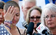 De 17-jarige scholier Emma Gonzalez, die vorige week de schietpartij op de Marjory Stoneman Douglasschool in Parkland overleefde, riep zaterdag de Amerikaanse regering op het wapenbezit aan te pakken. beeld AFP, Rhona Wise