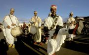 Musicerende moslims in Marrakech, Marokko. beeld Getty Images
