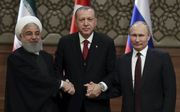 V.l.n.r. de presidenten Rouhani (Iran), Erdogan (Turkije) en Poetin (Rusland), begin april in Ankara. beeld AFP, Adem Altan