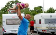 Vroeger kon je als alleenverdiener nog van je loontje op vakantie met de caravan. beeld ANP, Robin Utrecht