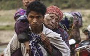 Duizenden mensen uit de noordelijke deelstaat Kachin van Myanmar ontvluchten hun regio. Velen van hen zijn christen.  beeld AFP, Zau Ring Hpara