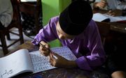 Leerling op een islamitische school in Cirebon, Java. beeld Jaco Klamer