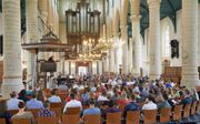 Ds. A. K. Wallet sprak maandag op het jaarlijkse pinksterappel in de Oude Kerk in Weesp. „De Geest des Heeren week van Saul. Mensen kunnen de Heilige Geest weren en uitblussen.” beeld Jaco Klamer