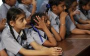 Indiase meisjes in Amritsar krijgen op school les in het voorkomen van seksueel misbruik.  beeld EPA, Raminder Pal Singh.