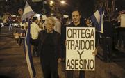 ”Ortega verrader en moordenaar”, meldt een spandoek van Nicaraguaanse betogers. beeld EPA, Esteban Biba