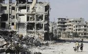 „In een stad als Damascus, die nu stevig in handen van president Assad is, is de schade enorm, maar wordt geen directe strijd meer geleverd en is wederopbouw mogelijk.” beeld AFP, Louai Beshara