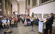 In de Grote Kerk van Dordrecht hield prof. dr. Judith Pollmann dinsdagavond een lezing over de oorzaken en gevolgen van de Dordtse Synode. beeld Dirk Hol