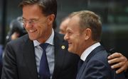 Rutte en Tusk, beeld AFP.