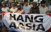 Aanhangers van de politieke partij Jamaat-e-Islami protesteren tegen het besluit van het Pakistaanse hooggerechtshof om de christin Asia Bibi vrij te laten. beeld AFP, Rizwan Tabassum