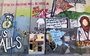 Graffiti op een muur in Bethlehem. beeld Alfred Muller