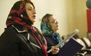 Een dienst in de Assyrische kerk in Teheran. Christenen in Iran staan steeds meer onder druk. beeld Jaco Klamer