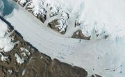 Rivier van smeltwater op Groenland. beeld EPA/NASA