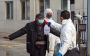 Desinfectie, maandag in Wuhan. beeld EPA, Yuan Zheng