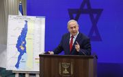 De Israëlische premier Netanyahu beloofde dinsdag annexatie Jordaanvallei. beeld EPA, Abir Sultan