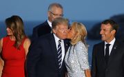 First lady Melania Trump, de Amerikaanse president Donald Trump, Brigitte Macron en de Franse president Emmanuel Macron. beeld AFP