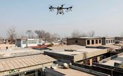 De Chinese autoriteiten zetten ook drones in bij de strijd tegen het coronavirus. beeld AFP, China Out