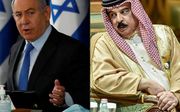De Israëlische premier Netanyahy en koning Hamad bin Isa Al Khalifa van Bahrein. beeld AFP, Ronen Zvulun en Fayez Nureldine