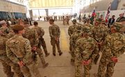 Militaire adviseurs van de internationale coalitie in Arbil, Irak, waaraan ook Nederlandse soldaten meedoen. beeld AFP