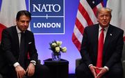 Donald Trump met de premier van Italië tijdens een NAVO-top. beeld AFP, Nicholas Kamm