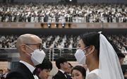 Massale huwelijkssluiting in Zuid-Korea, met angst voor het coronavirus. beeld AFP
