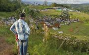 Massa-begrafenis in Colombia na de aardverschuivingen. beeld AFP