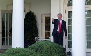 President Donald Trump heeft een elfjarige jongen uit Virginia voor even aangesteld als assistent-tuinman van het Witte Huis. beeld AFP