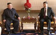 Kim Jong-un en Xi Jinping tijdens een eerder bezoek. beeld AFP