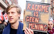 Betogers in maart tijdens de jaarlijkse anti-racismedemonstratie in Amsterdam. beeld ANP