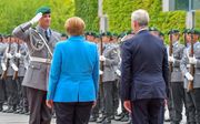Merkel en de Finse president Rinne. beeld AFP