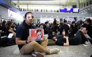 Demonstranten vandaag op Hong Kong Chek Lap Kok, het vliegveld van Hongkong. beeld EPA