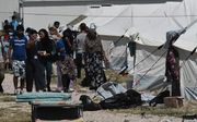 In het vluchtelingenkamp op Lesbos zitten meer dan 10.000 vluchtelingen. beeld AFP, Sakis Mitrolidis