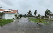 Stormschade aan een huis in Freeport, de Bahama's. beeld AFP