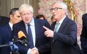 Johnson en Juncker. beeld AFP