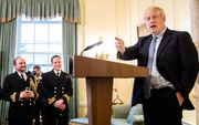 Boris Johnson sprak gisteren een groep Britse militairen toe tijdens een receptie in Londen. beeld AFP