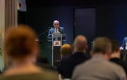 Dr. A. A. A. Prosman spreekt dinsdag tijdens de ontmoetingsmiddag in Nijkerk van het hoofdbestuur van de Gereformeerde Bond (GB) in de Protestantse Kerk in Nederland. beeld André Dorst