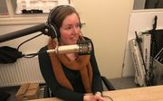 Gertrude van den Belt in de podcaststudio. beeld RD