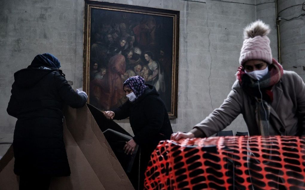 Migrants set up shelters as they occupy Saint-Jean-Baptiste-au-Beguinage church in Brussels on February 1, 2021. photo AFP, Kenzo Tribouillard