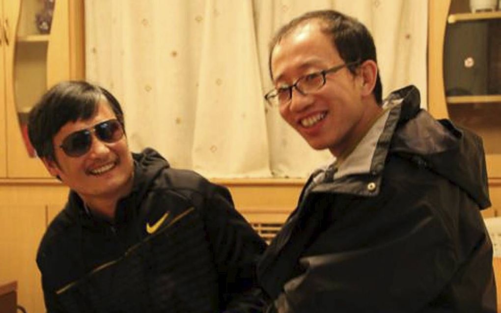 Chen Guangcheng (l.) en Hu Jia. Foto EPA