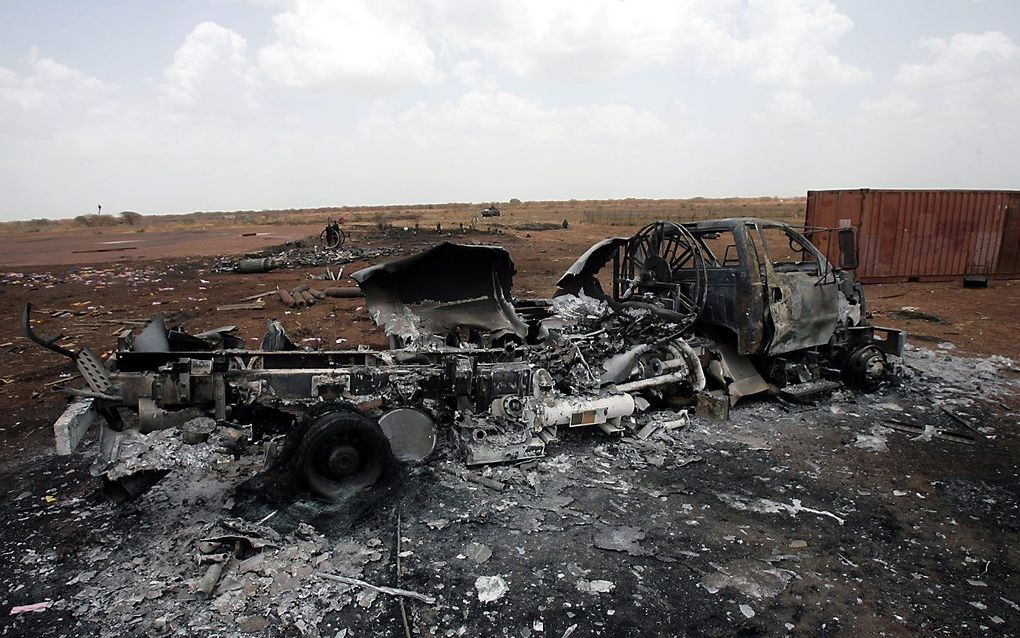 Verbrande auto's door ongeregeldheden in Sudan.  Foto EPA