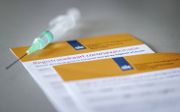 Een registratiekaart coronavaccinatie. Het certificaat wordt verstrekt aan mensen die volledig zijn gevaccineerd tegen het coronavirus. beeld ANP, Koen van Weel